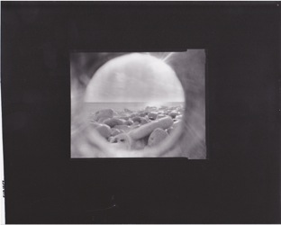 Pinhole photo white rocks on beach